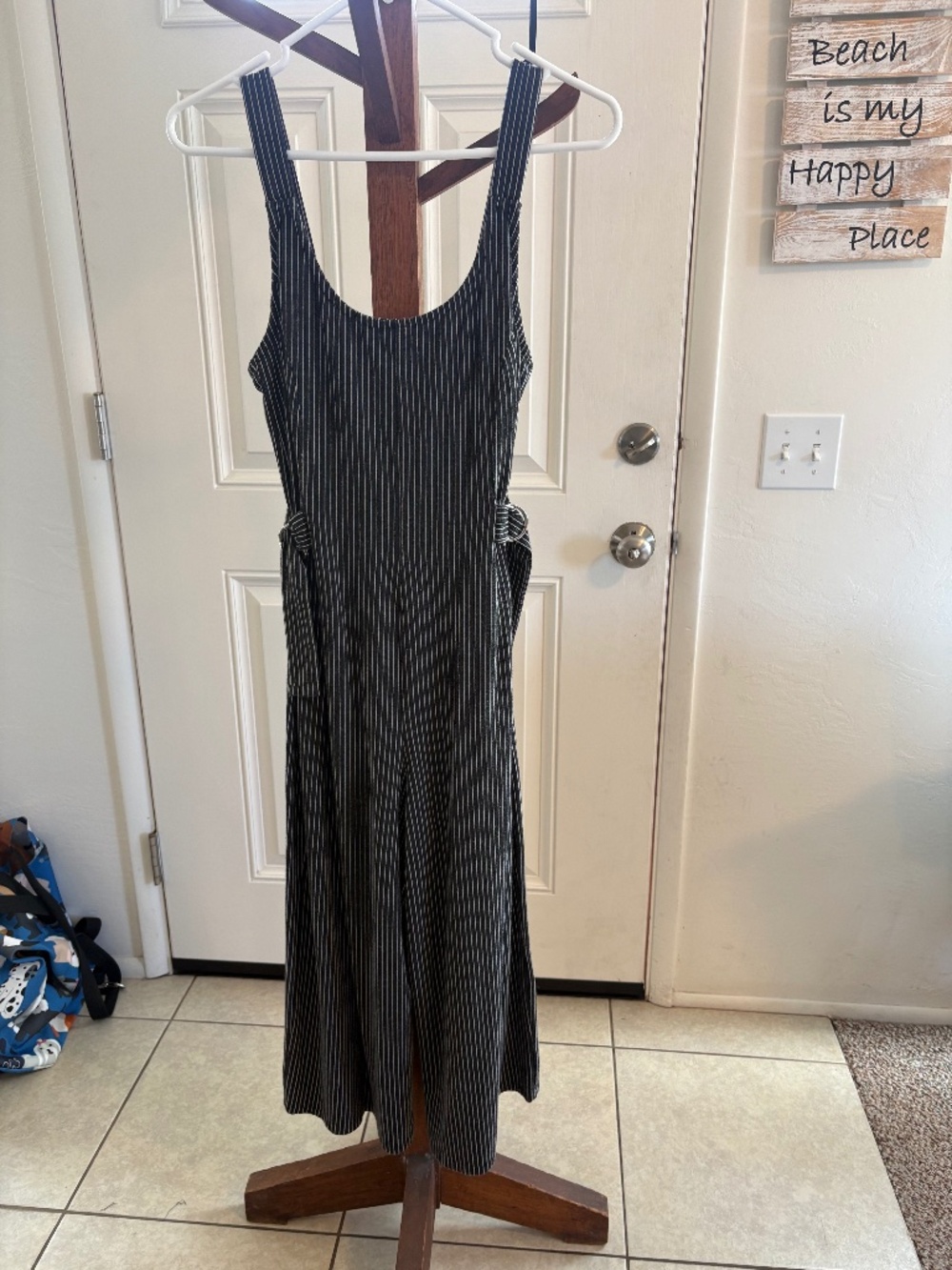 Pinstripe jumpsuit with side fasteners